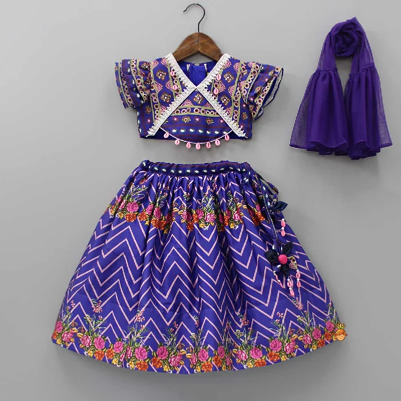 Layered Sleeves Blue Top And Fabric Flower Tassels Enhanced Lehenga With Purple Net Dupatta